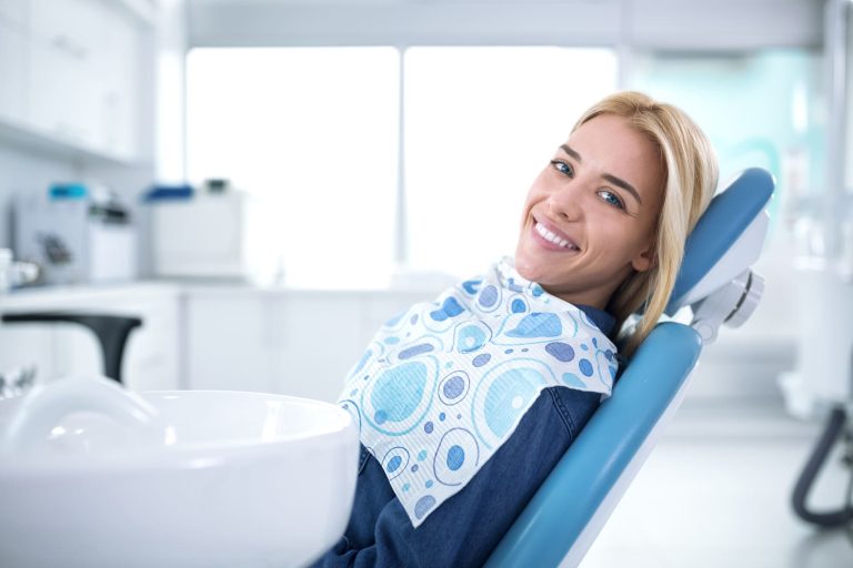 What does gum pain around a dental bridge suggest?